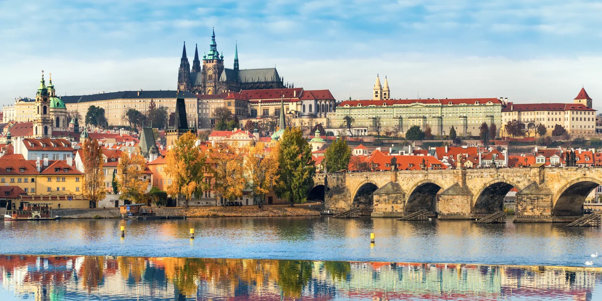Prague Castle and Charles Bridge over the Vltava in autumn
